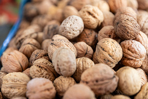 Close-up of Whole Walnuts in Shells, a Food & Drink Photo by Imaginarium