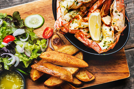 Shrimps with french fries featuring burger, wood, and grill, a Food & Drink Photo by rawpixel