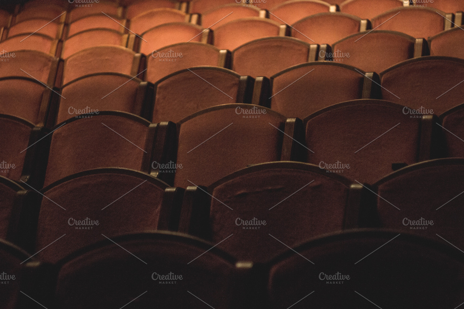 Theater seats featuring row, pattern, and seat