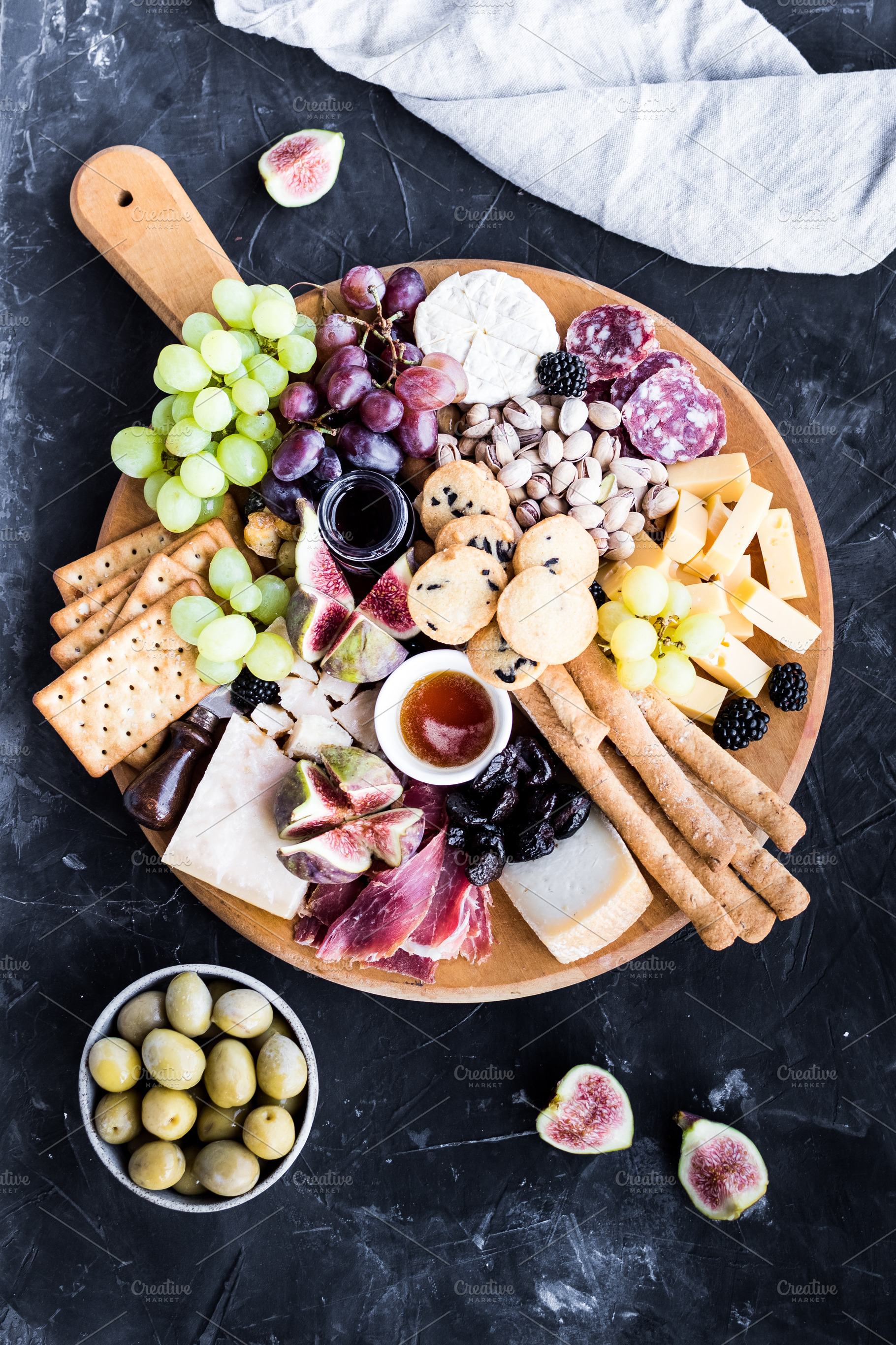 Assortment of tasty appetizers or containing charcuterie, cheese, and platter, a Food & Drink Photo by NelliKovalchuk