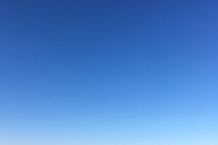 Sea. Sandy beach and blue sky, a Nature Photo by Canatic