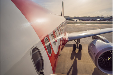Airplane wing and turbine on airport, a Transportation Photo by Elizaveta Galitskaya