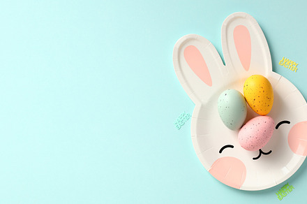 Happy Easter concept. Flat lay composition with colorful Easter eggs on plate i, a Holiday Photo by photoguns