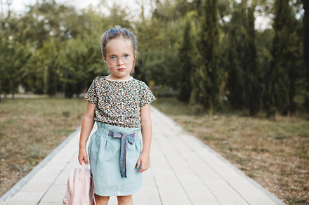 Kid girl with backpack outdoor, a Person Photo by morrowlight