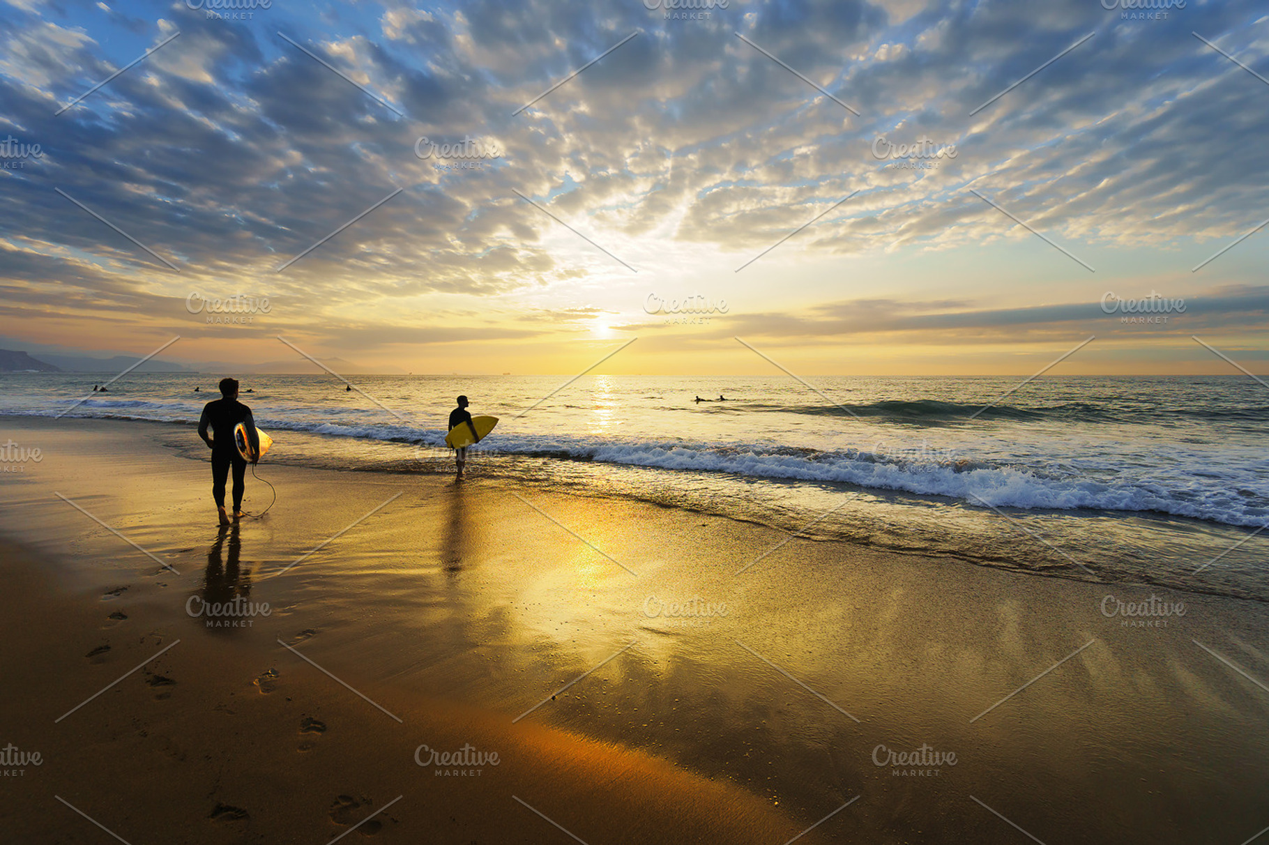 Surfers at sunset, a Nature Photo by mimadeo