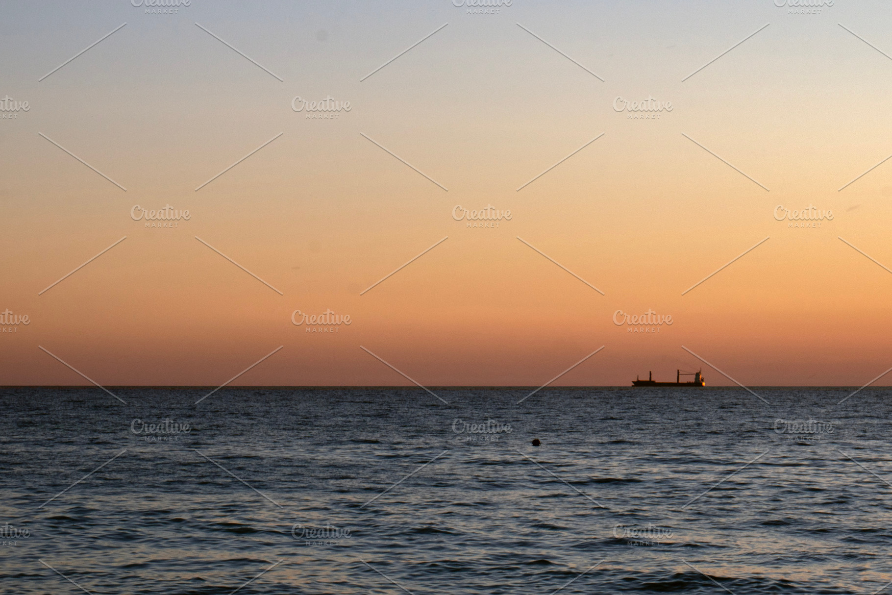 Sea at sunset and silhouette of ship, a Nature Photo by Schreibikus