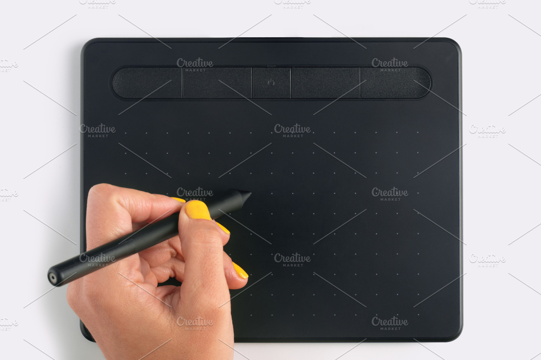 Close-up of a hand holding a stylus on a black digital graphic t, a Technology Photo by Ales Munt