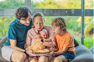 Happy family celebrating their, a Person Photo by Elizaveta Galitskaya