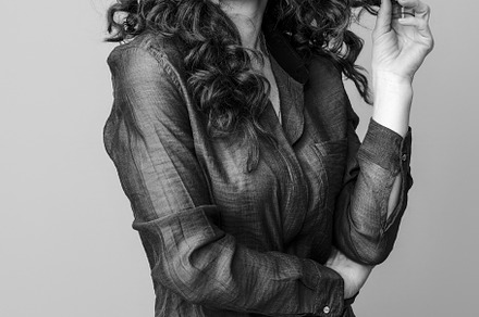 smiling trendy woman isolated on background in glasses, a Person Photo by Alliance Images