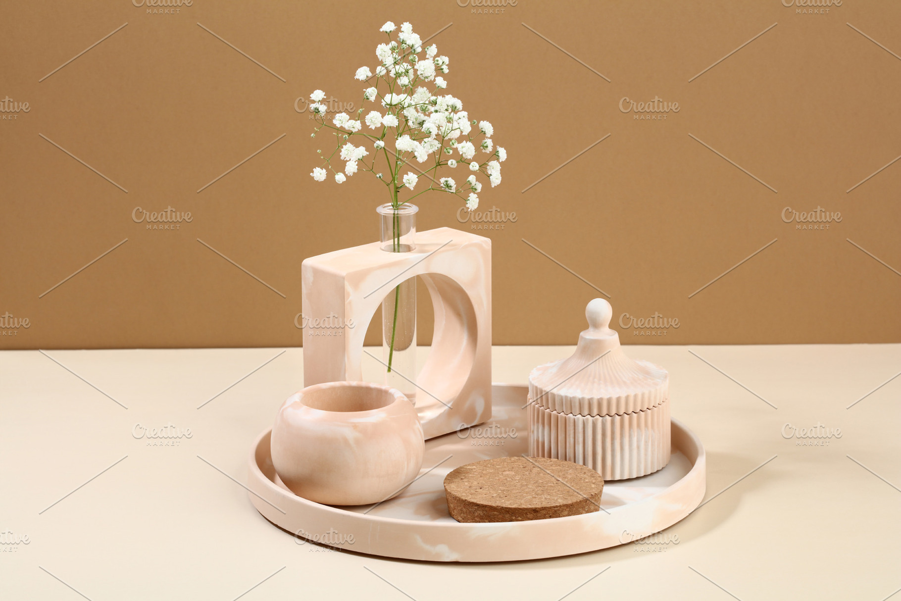 Modern DIY concrete home decor on beige background. Vase of flowers, cup, podiu, a Beauty & Fashion Photo by photoguns