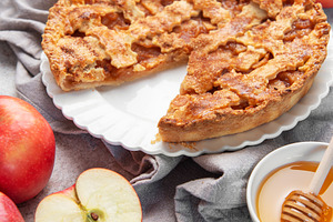 Apple pie with slice removed surrounded by fresh apples, a Food & Drink Photo by Olena Rudo