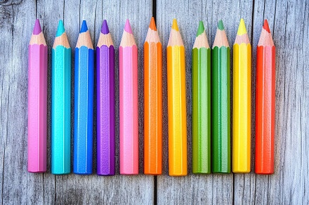 Wooden colorful rainbow pencils on wooden table, a Background Photo by AlyaAnd