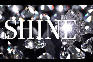 The word SHINE spelled out with glittering diamonds on black bac, a Photo by Dvoevnore photos