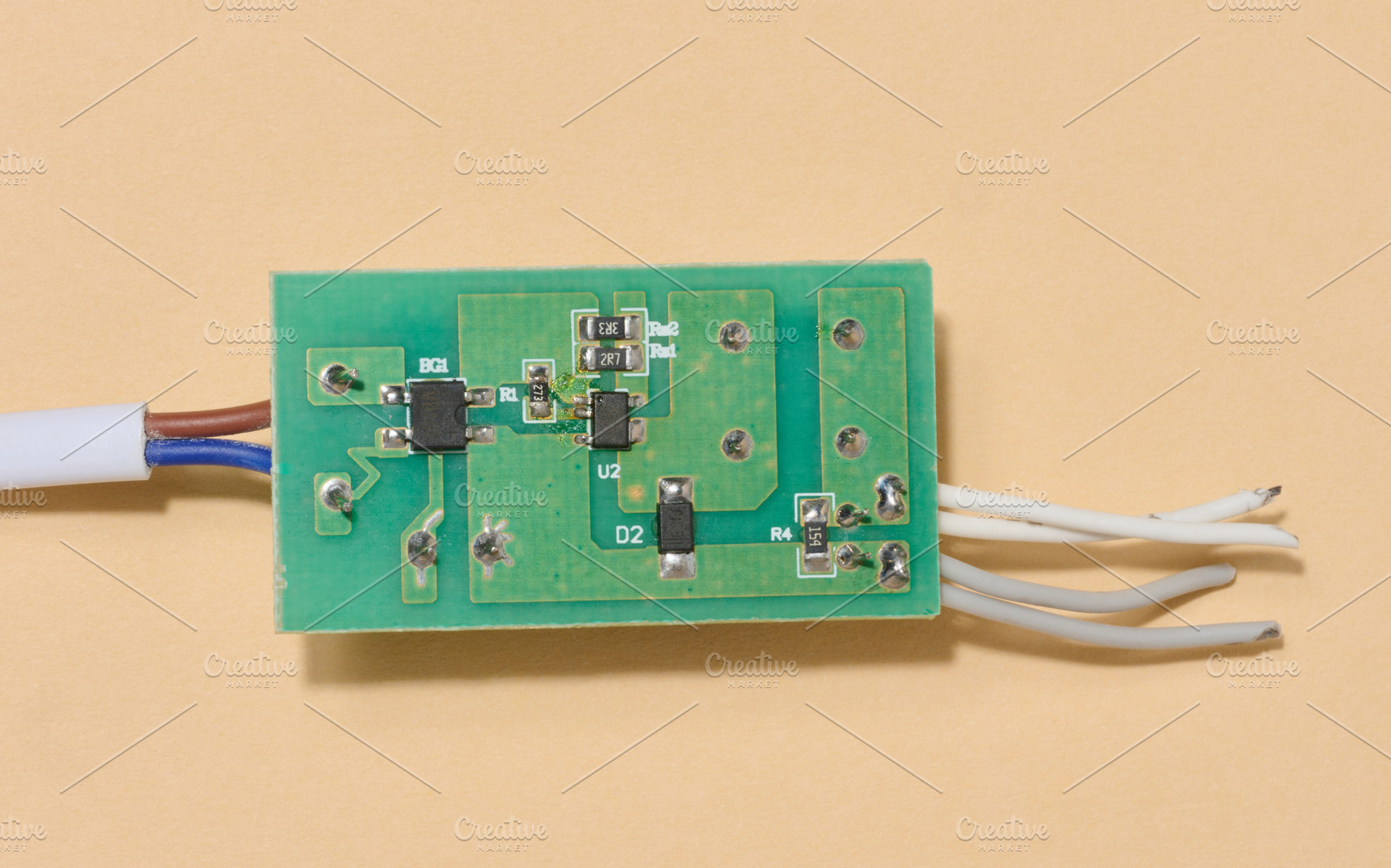 Green electronic board with components and some wires placed on, a Technology Photo by ndanko