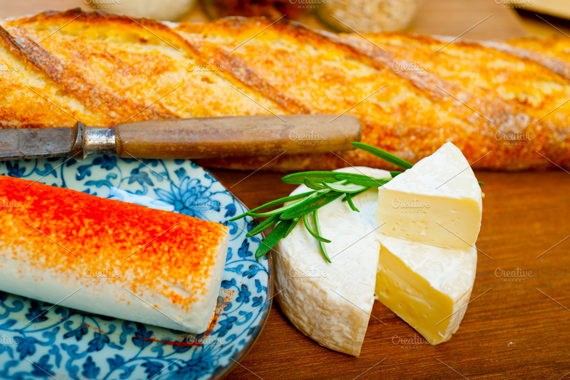 French cheese and fresh  baguette on a wood cutter, a Food & Drink Photo by keko64