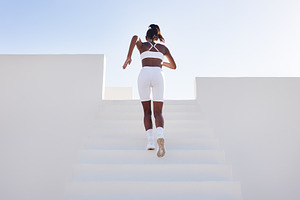 Back view of a woman in white sports, a Sports & Recreation Photo by Artem Varnitsin