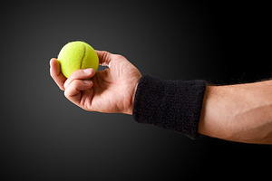 Hand Holding a Tennis Ball with Wristband, a Sports & Recreation Photo by Davizro's Market