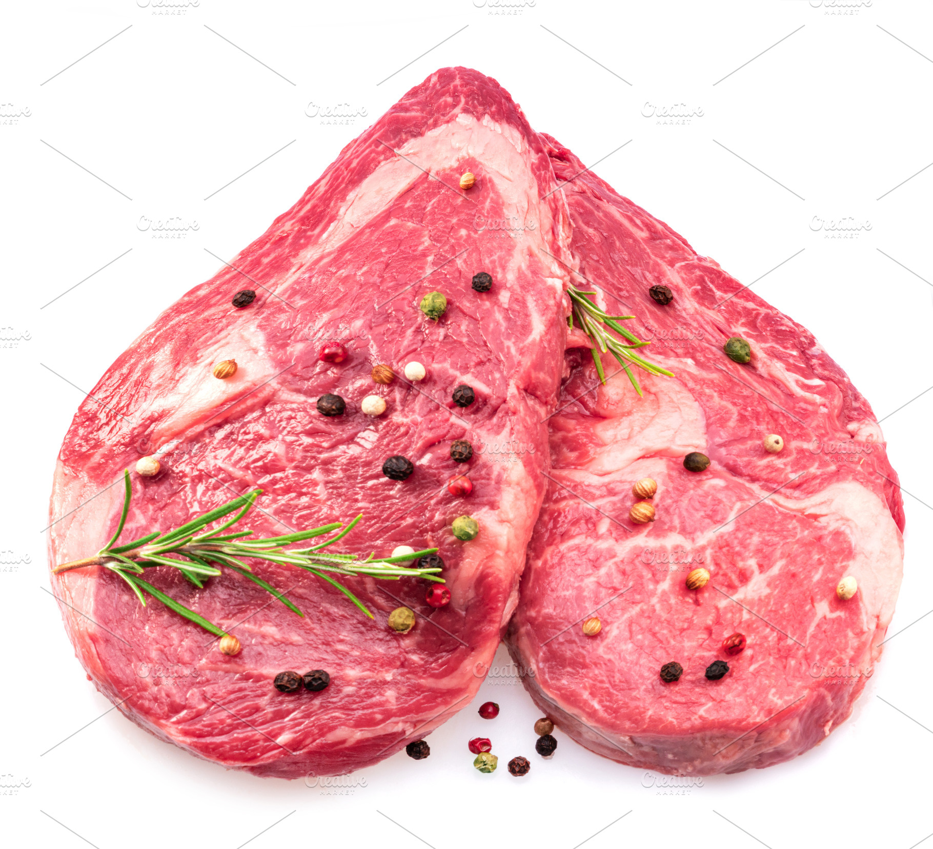 Two fresh ribeye steaks with peppercorn and rosemary isolated on, a Food & Drink Photo by Volff
