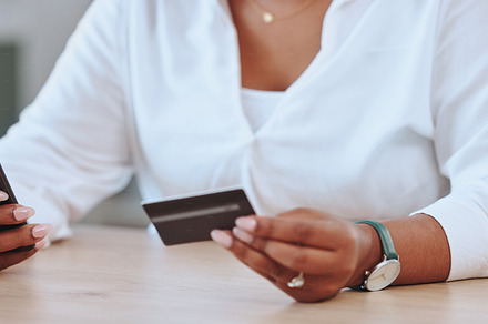 Payments, banking and shopping being done by a woman with a credit card and phone. Female entrepreneur, businesswoman or boss paying for a product on the internet, app or website online at work, a Photo by Peopleimages.com