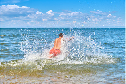 A young man runs into Lake Baikal