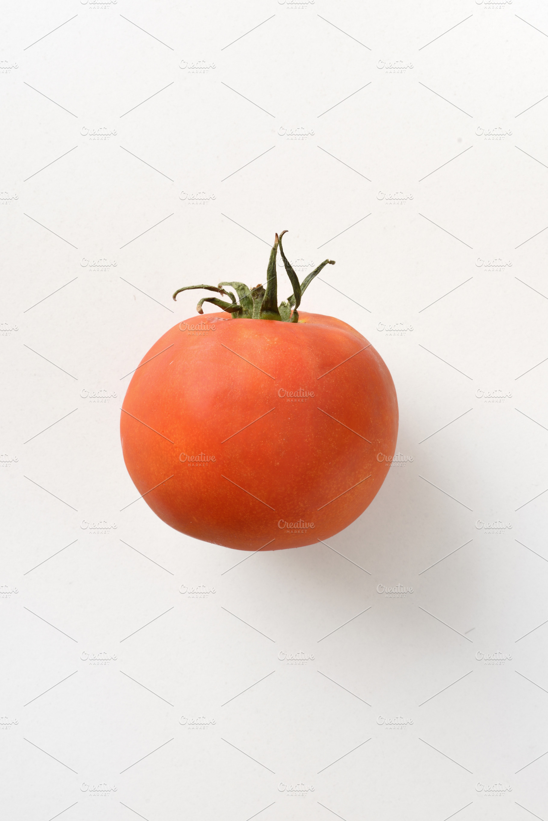 Tomato detail on white background, a Food & Drink Photo by Davizro's Market