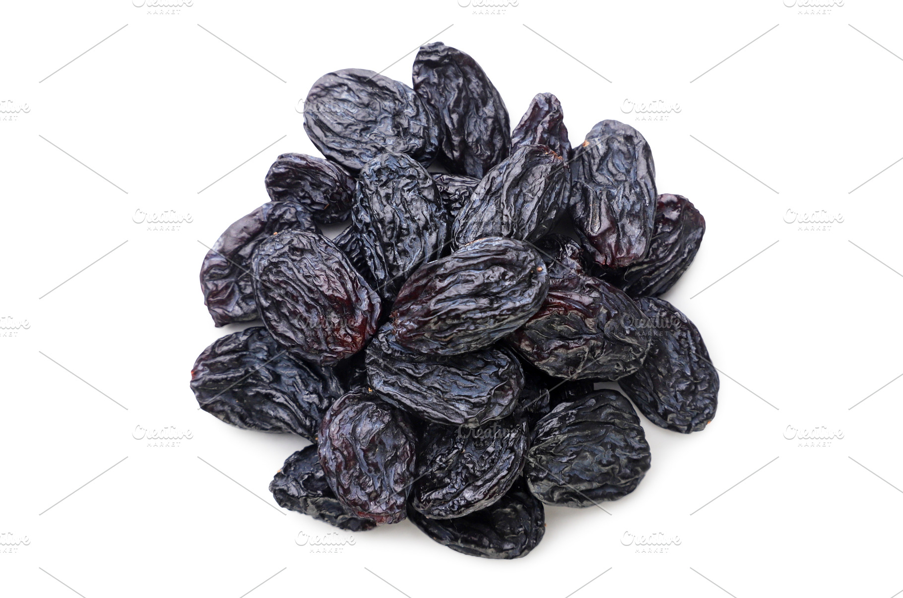 Pile of black raisins on a white, a Food & Drink Photo by innakreativ