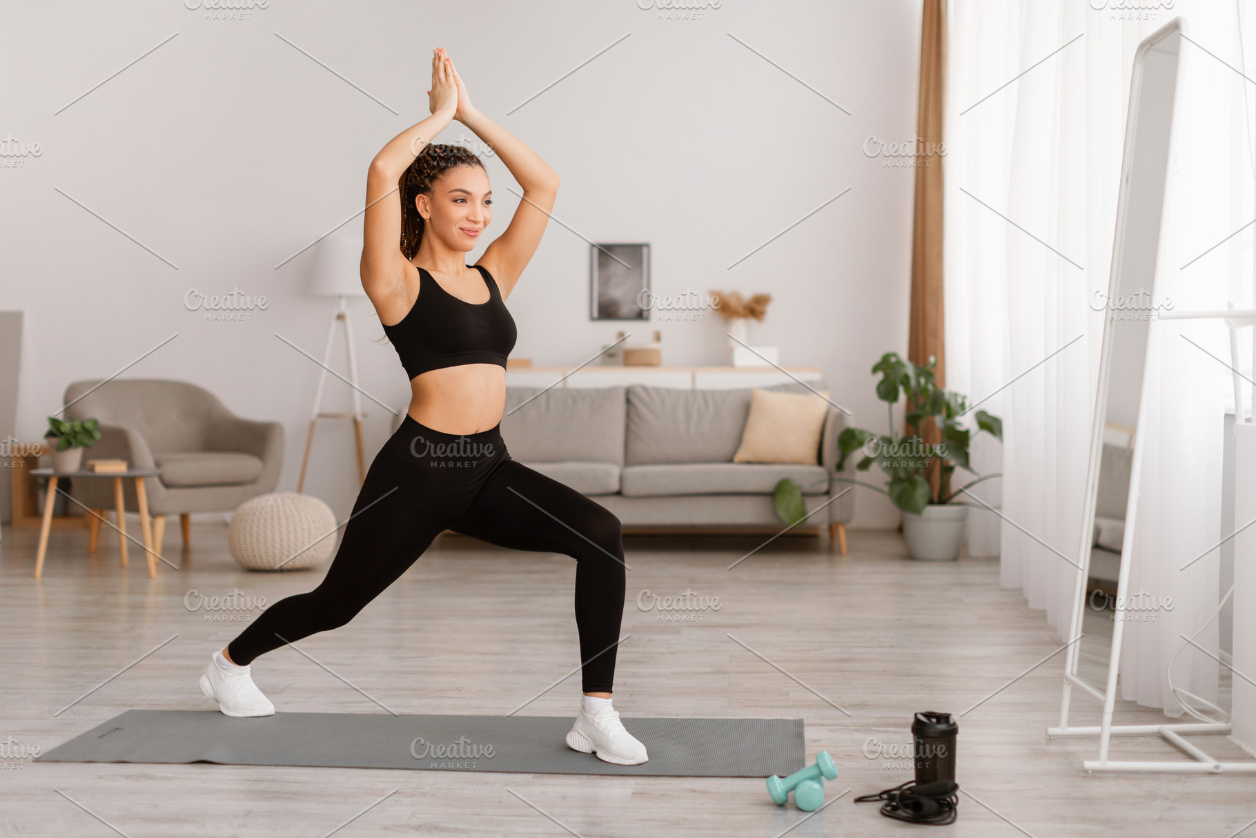 Lady Exercising Standing In Forward Lunge Joining Raised Hands Indoor, a Photo by Prostock-Studio