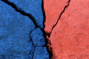 Cracked concrete surface in two colors, Conflict and divisio, a Photo by salmon.black