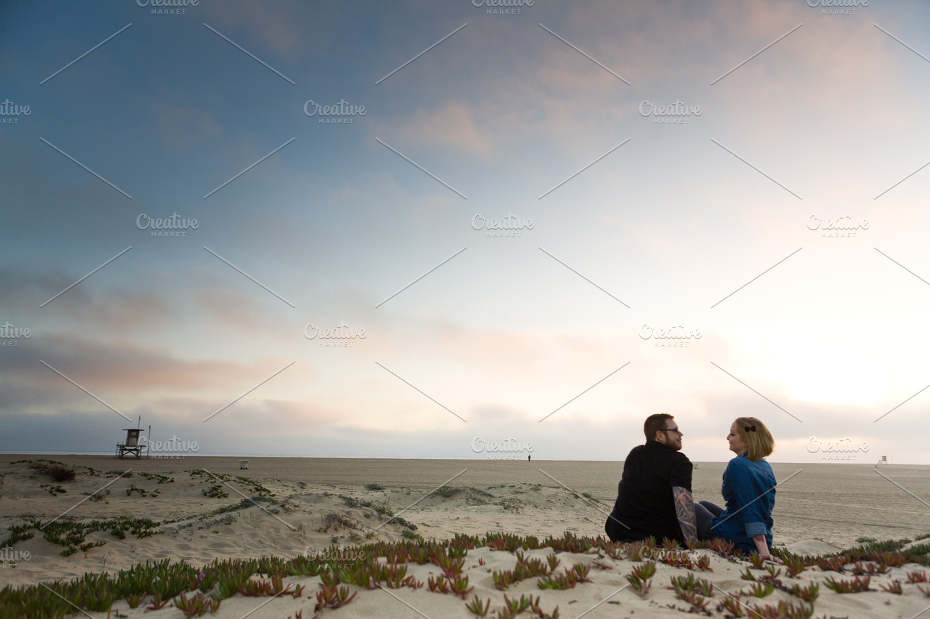 Engagement Couple Sitting on Beach