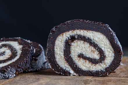 chocolate roll with a creamy curd layer in coconut chips, a Photo by MyPhotos