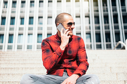 Young man with mobile phone containing mobile, man, and phone, a Person Photo by nunezimage