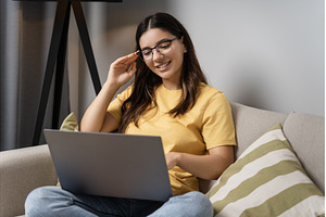 Relaxed on the sofa, a woman in, a Person Photo by AD Stock Images