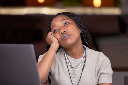 Tired, bored and thinking black woman at work with depression, stress and sad about workload. Idea, problem and depressed African employee with contemplation about a project, task or deadline, a Photo by Peopleimages.com