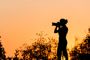Female Photographer Silhouette, a Person Photo by THP Creative