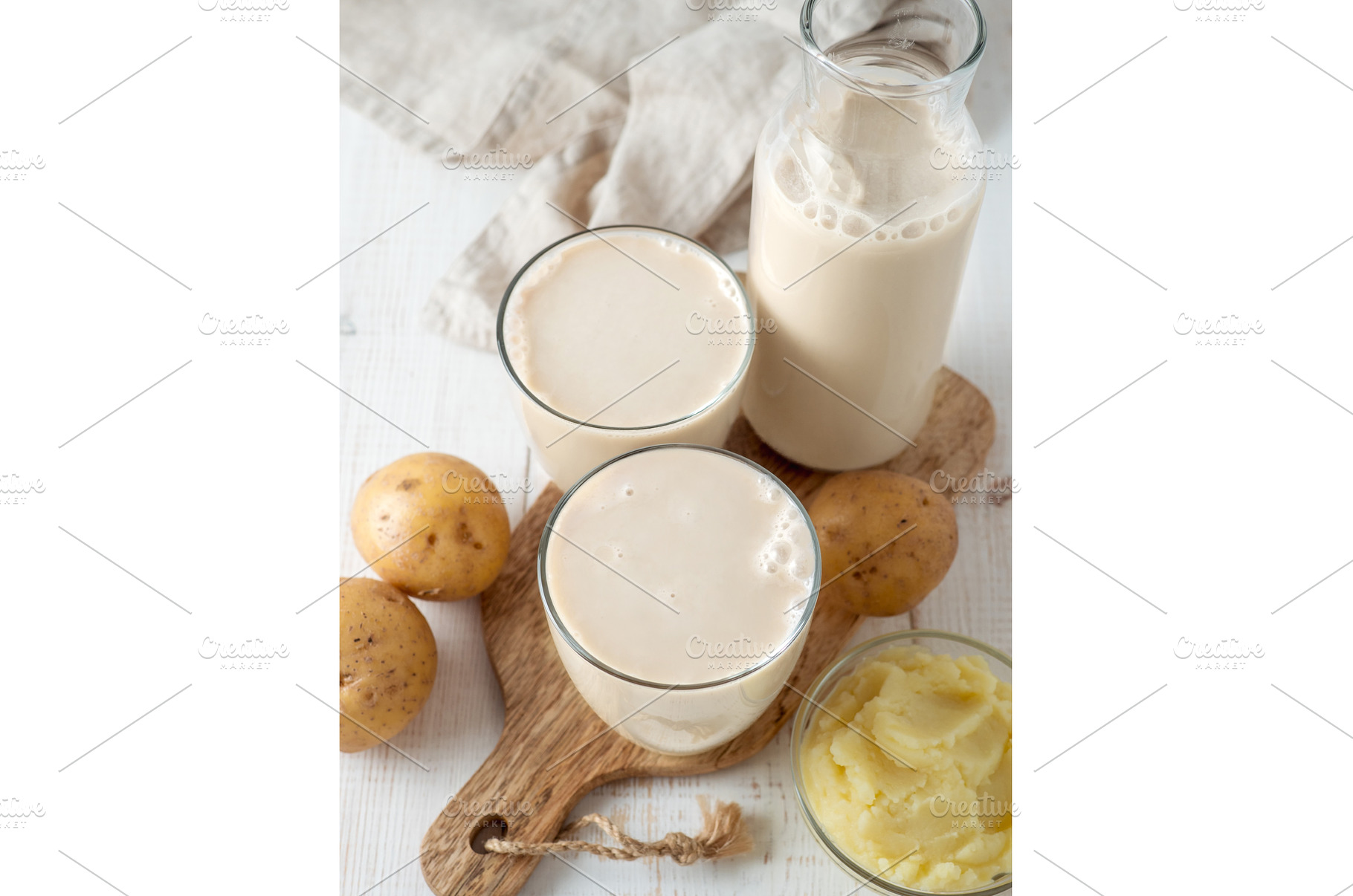 Potato milk pouring into glass on, a Food & Drink Photo by Fascinadora