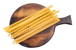 Delicate raw mafaldine pasta noodles, perfect for tossing with f, a Food & Drink Photo by composter-box@mail.ru