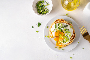 Tasty savory breakfast pancakes with spring green onion and frie, a Food & Drink Photo by Rimma