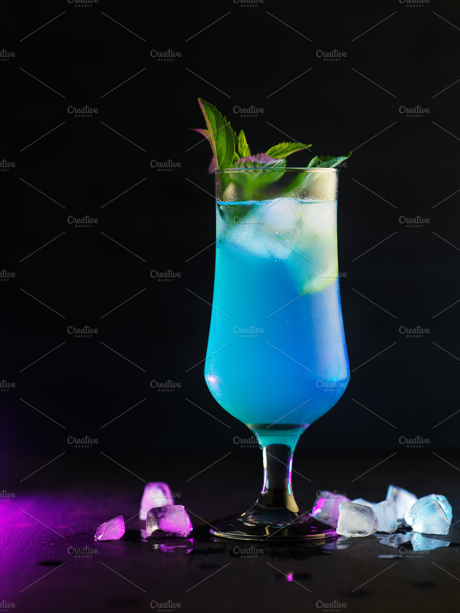 Blue lagoon cocktail with lemon slice and mint leaves., a Food & Drink Photo by PavelKant