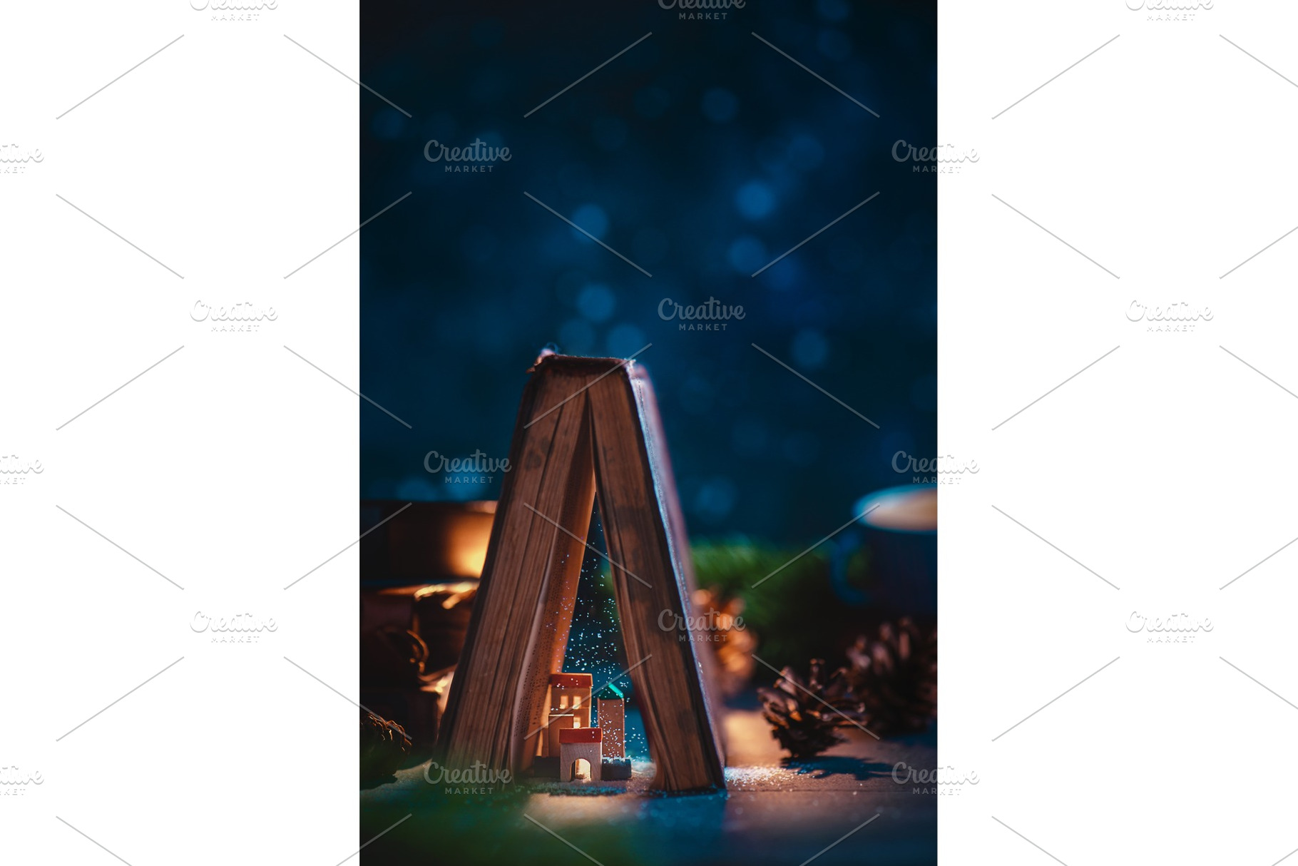 Miniature city under an open book, an Architecture Photo by dinabelenko