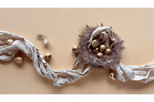 Quail eggs in a decorative nest with, a Photo by tilialucida