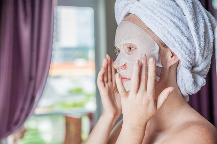 Young red-haired woman doing facial, a Beauty & Fashion Photo by Elizaveta Galitskaya