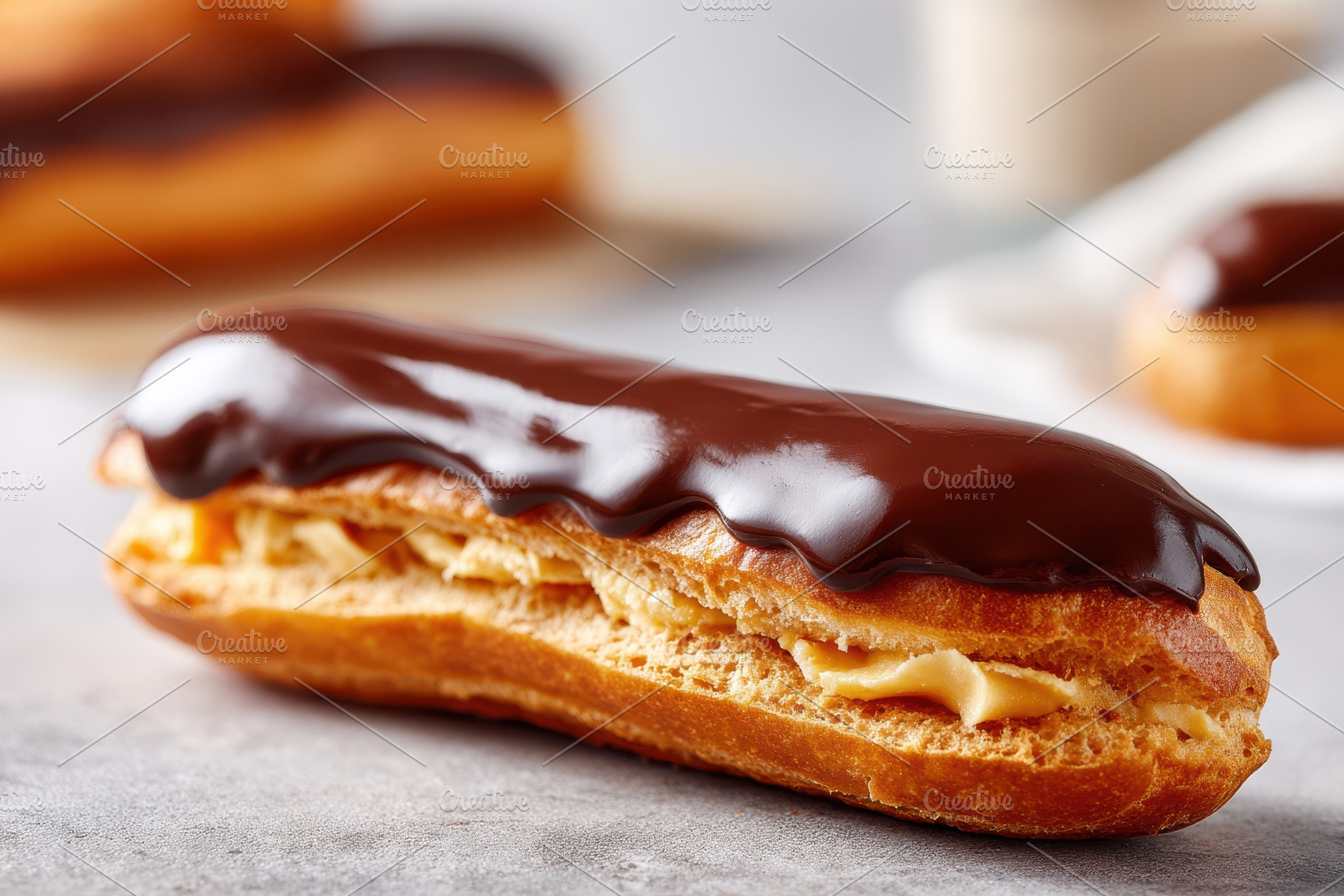 Chocolate-glazed eclair with custard filling, a Food & Drink Photo by AlyaAnd