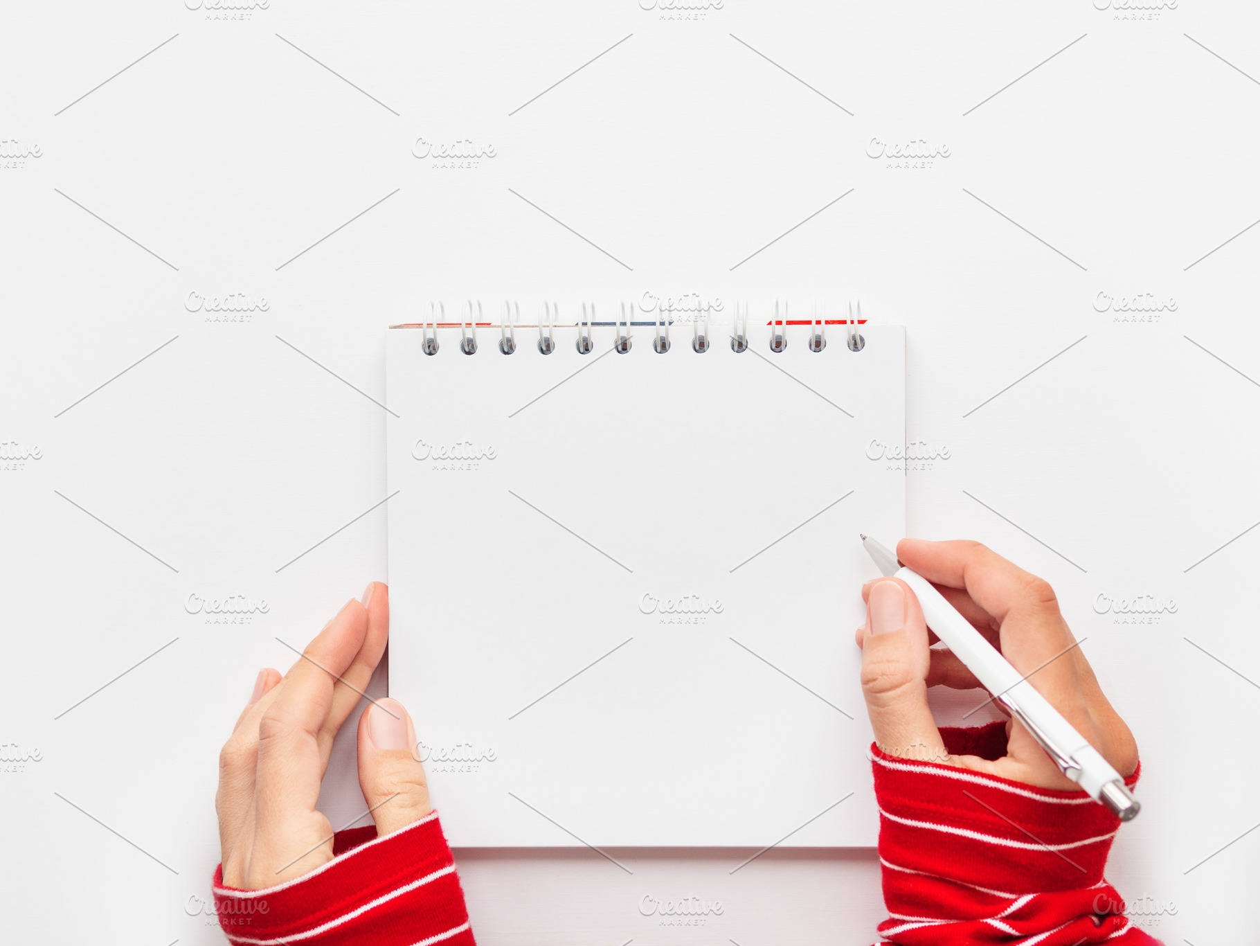 Woman in red sweater, notepad, a School & Education Photo by Aksenov_K