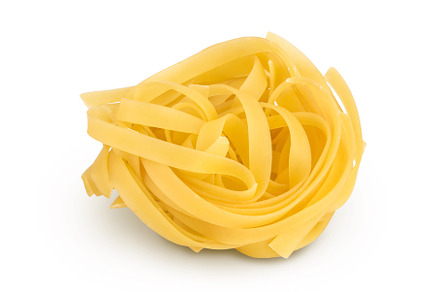 Raw tagliatelle pasta isolated on, a Food & Drink Photo by NataPhoto