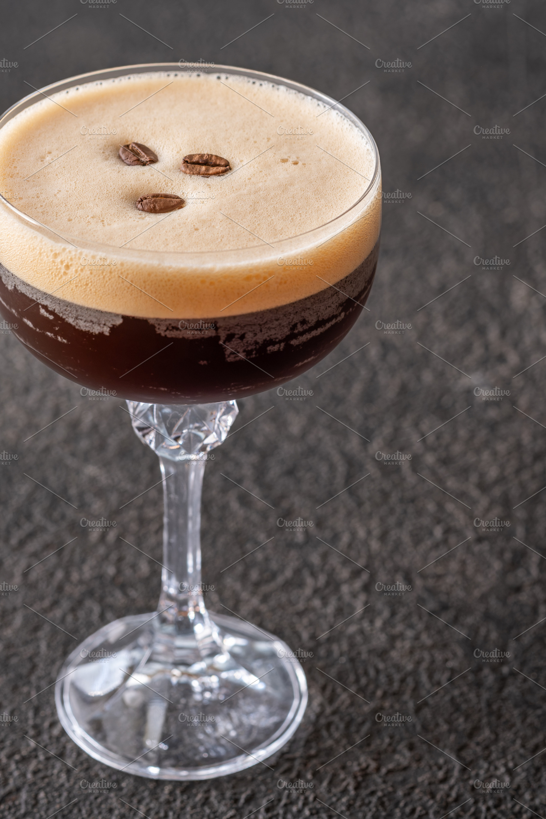 Classic Espresso Martini with thick crema foam and coffee bean g, a Food & Drink Photo by Alexander Prokopenko