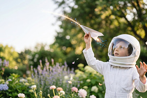 Kid plays with plane outside, a Photo by Beautiful things
