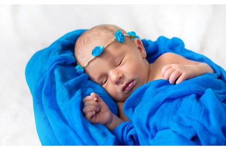 Newborn baby sleeping on a blue, a Person Photo by yanadjana