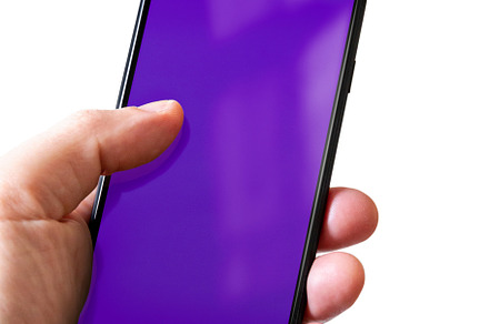 Hand holding a smartphone with blank purple screen. Isolated on, a Technology Photo by GoodGoods