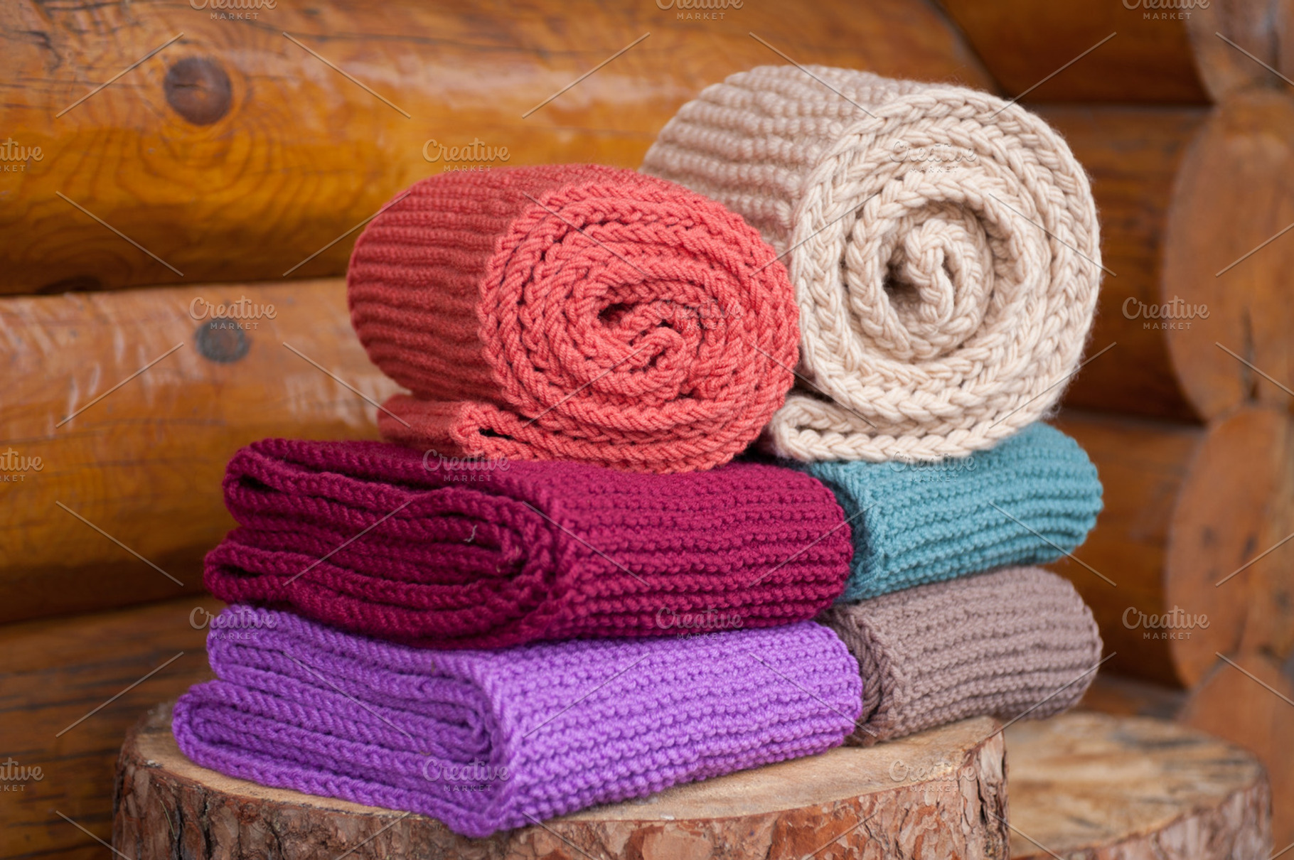 Six roll knitted scarf on wooden background featuring neck, wrap, and winter, a Beauty & Fashion Photo by MarinaMassel