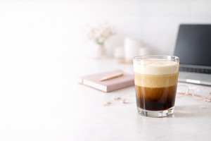 Protein coffee drink with modern workspace background, copy spac, a Photo by Dvoevnore photos
